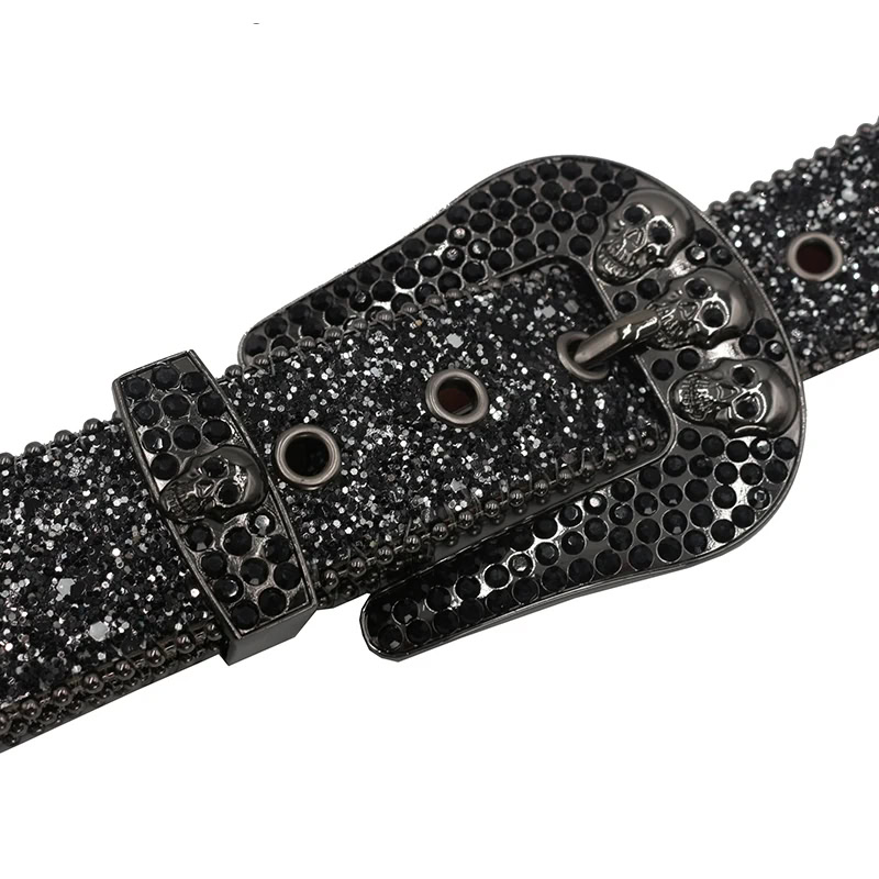 The “Afterworld Bling” Y2K Skull & Rhinestone Studded Belt Bling Y2K skull belt with rhinestones and skull details, perfect for edgy fashion statements.