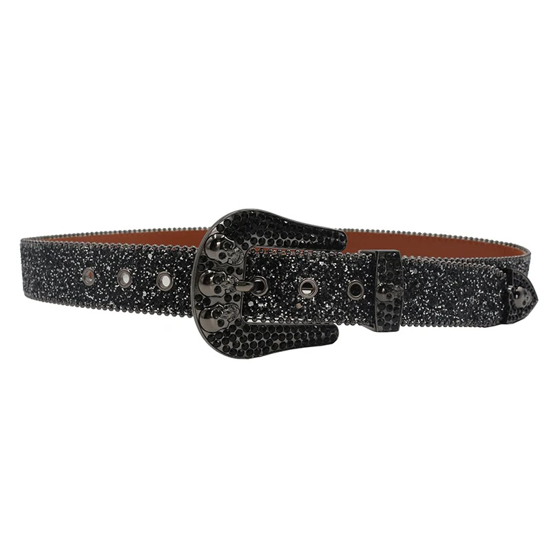 Black rhinestone-studded belt with skull and Y2K-inspired design, perfect for edgy fashion statements. Black rhinestone skull belt with Y2K style, rhinestone embellishments, and adjustable fit.