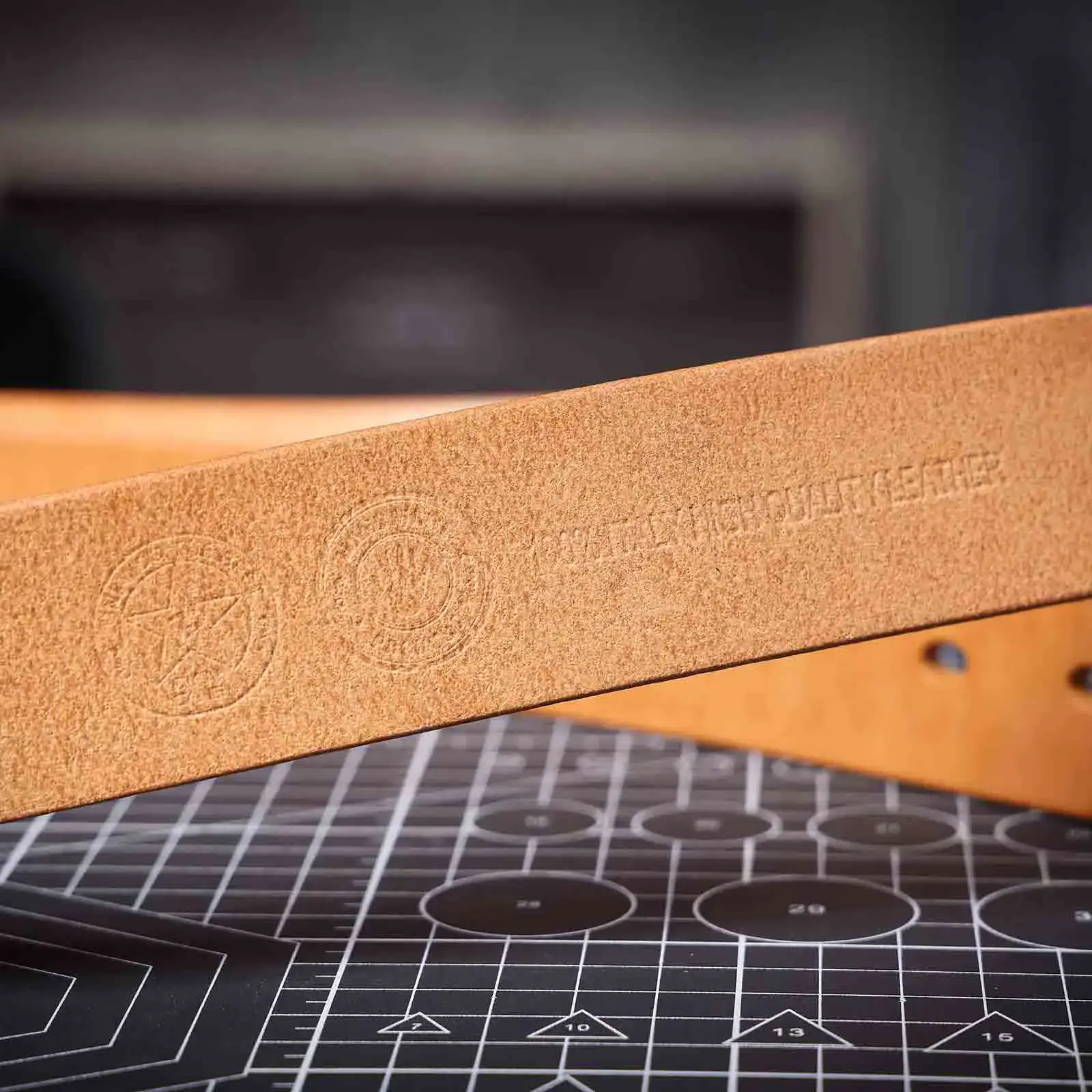Premium Khaki Italian Leather Belt for Men Durable thickened khaki leather belt with embossed logo details.