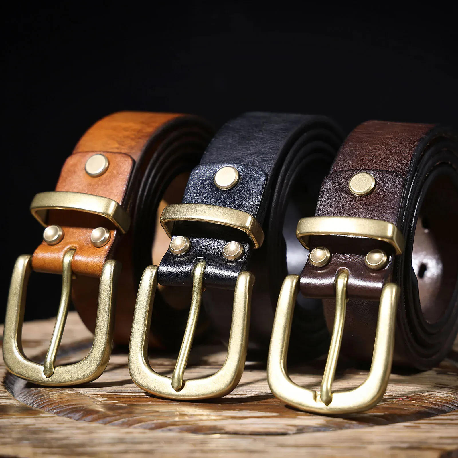Handmade Brass & Cowhide Belts Elegant leather belts with brass buckles and Italian cowhide straps.