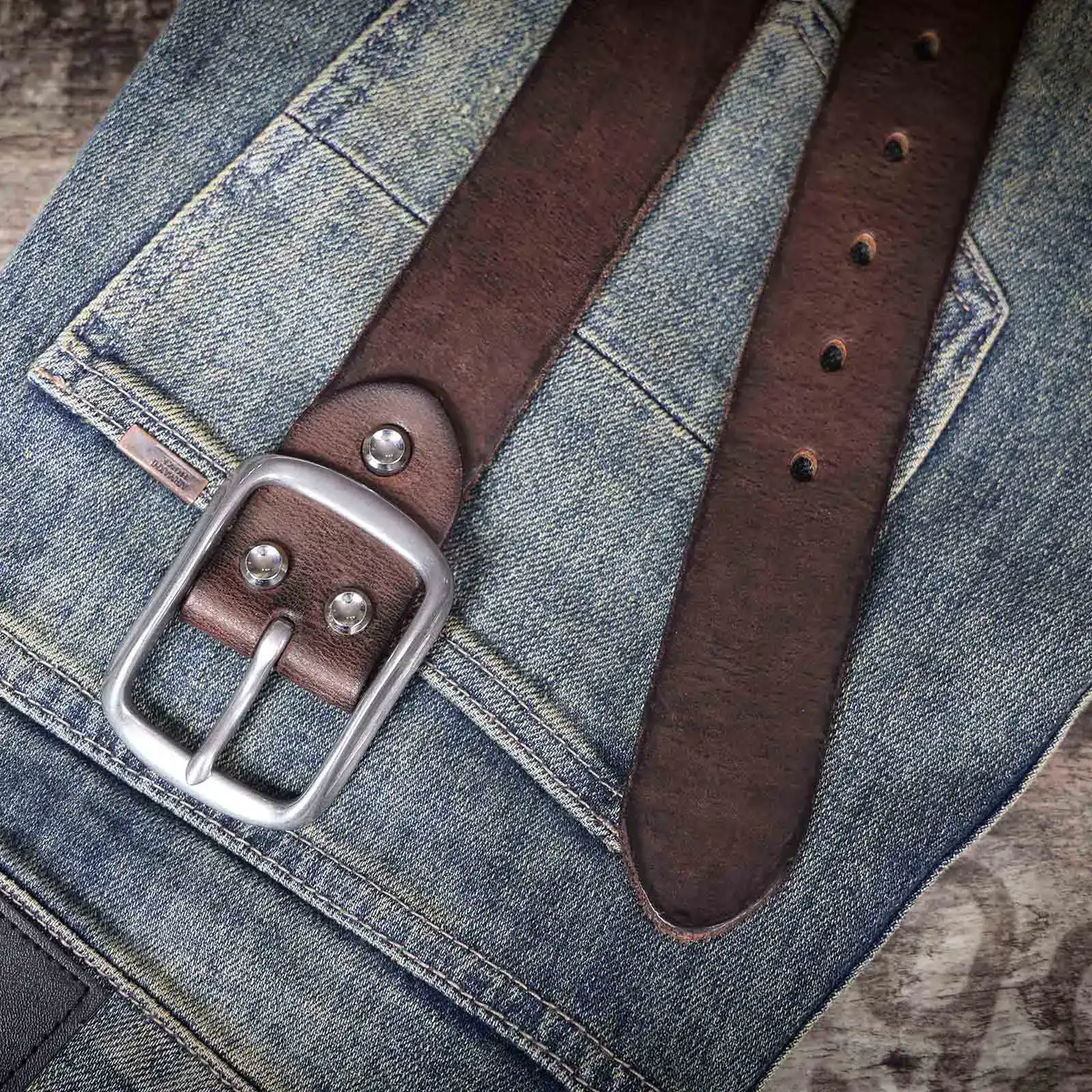 Vintage Leather Men’s Cowhide Belt with Steel Buckle Leather men's belt with stainless steel buckle on denim jeans.