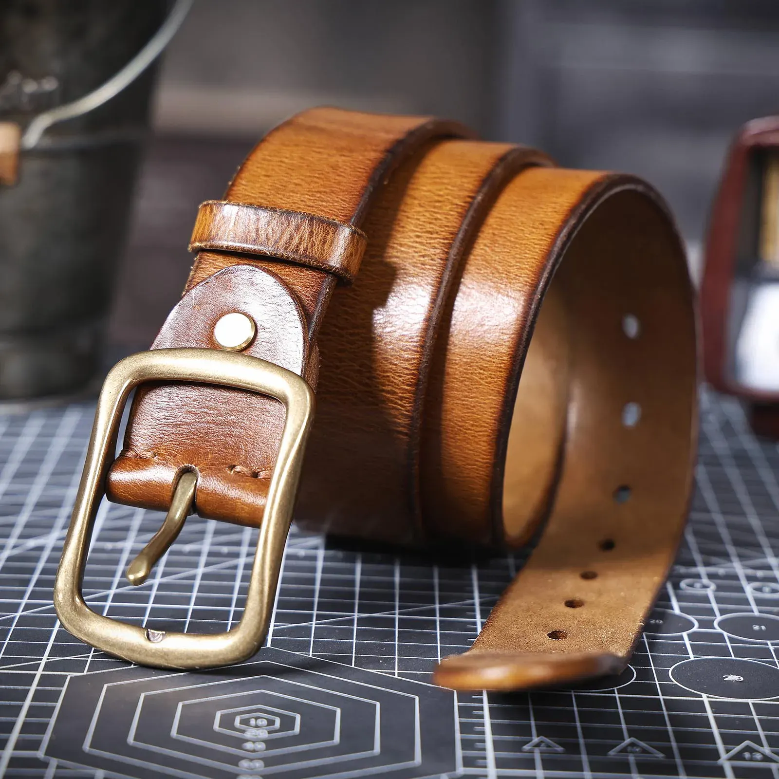 Leather men's belt with solid brass buckle, vintage style and durable craftsmanship.