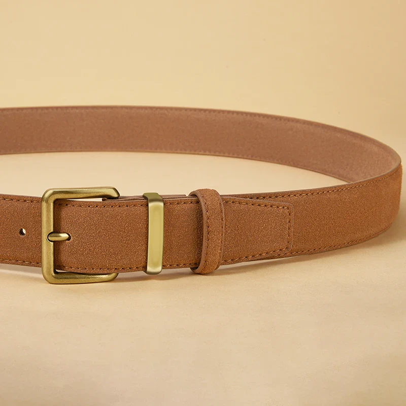 Elegant suede cowhide belt with gold buckle for luxury fashion Luxury suede cowhide belt with gold buckle for sophisticated style.