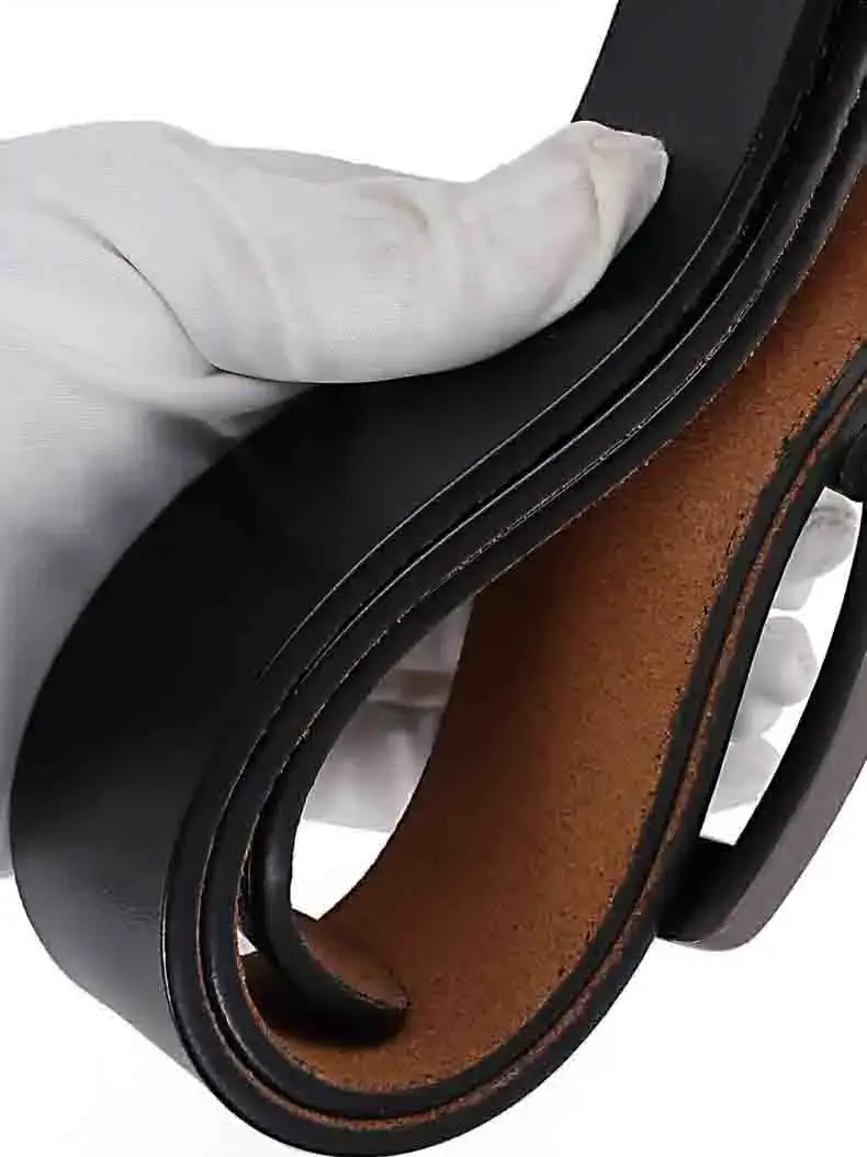 Heavy-duty cowskin belt with black leather exterior and brown interior. Durable genuine cowskin belt ideal for heavy-duty use and rugged style.