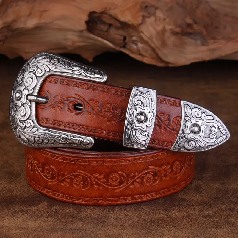 Western Outlaw Leather Belt with Embossed Steel Buckle Embossed steel buckle on Western Outlaw leather belt, detailed floral design, durable and stylish we.