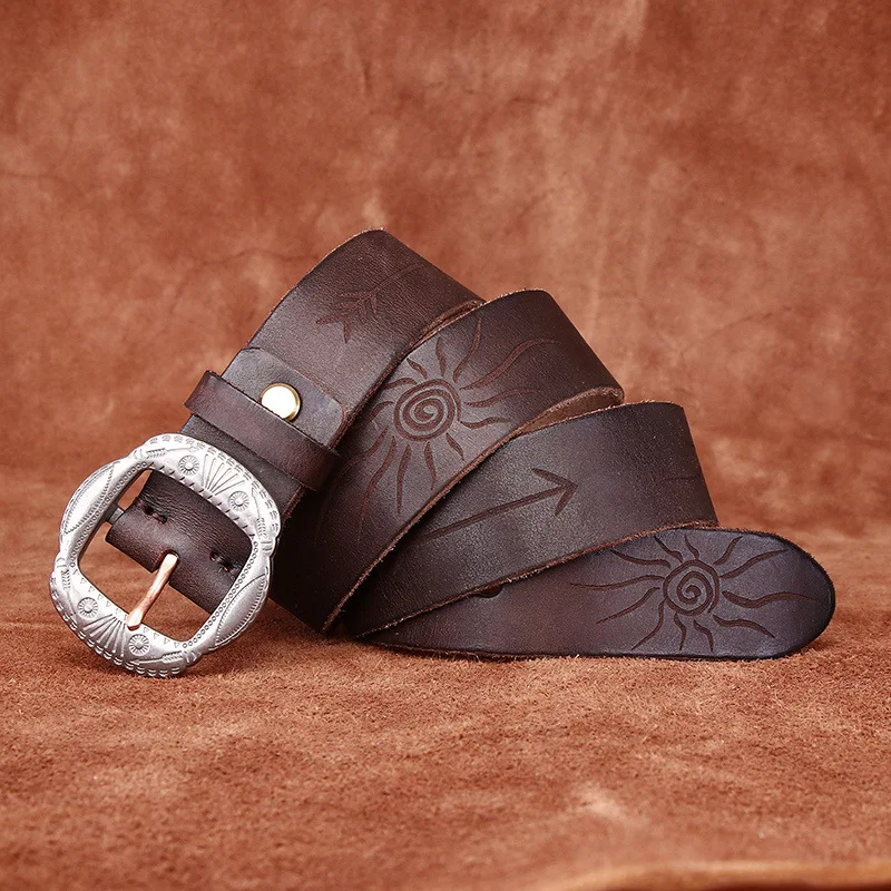 Vintage Leather Belt with Sun and Arrow Designs Vintage leather belt with sun and arrow embossed patterns, full grain washed finish, and a silver bu.