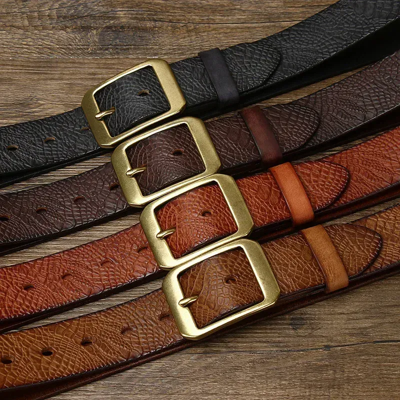 Heritage 38 Caiman Crocodile Leather Belts Caiman crocodile embossed leather belts with solid brass buckles in black, brown, and tan. Elegant,.