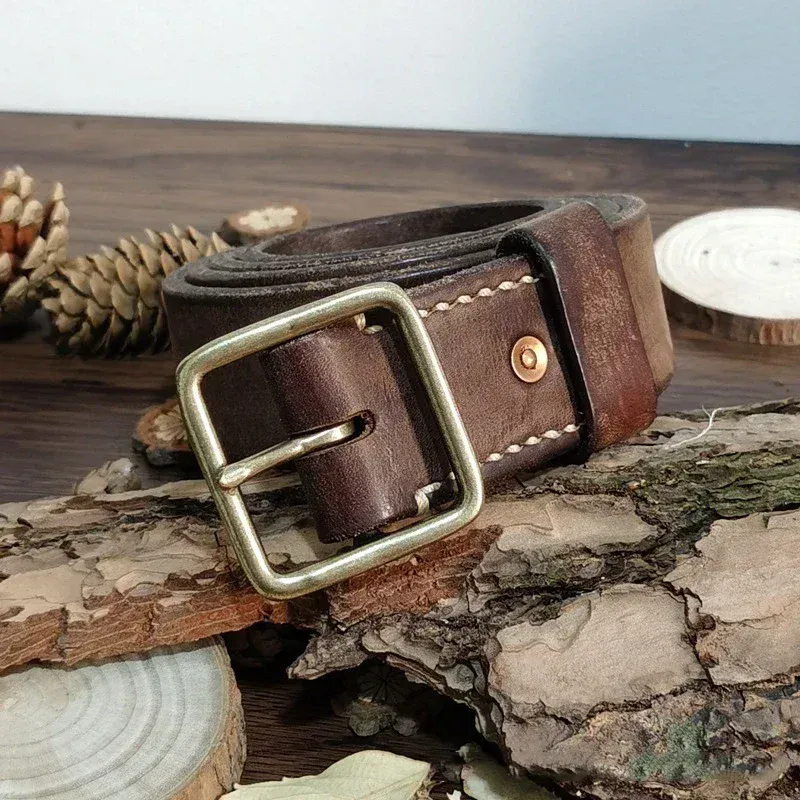 Titan 41 Heavy-Duty Leather Belt with Brass Buckle Durable full-grain leather belt featuring a solid brass buckle for rugged style. Perfect for work or.