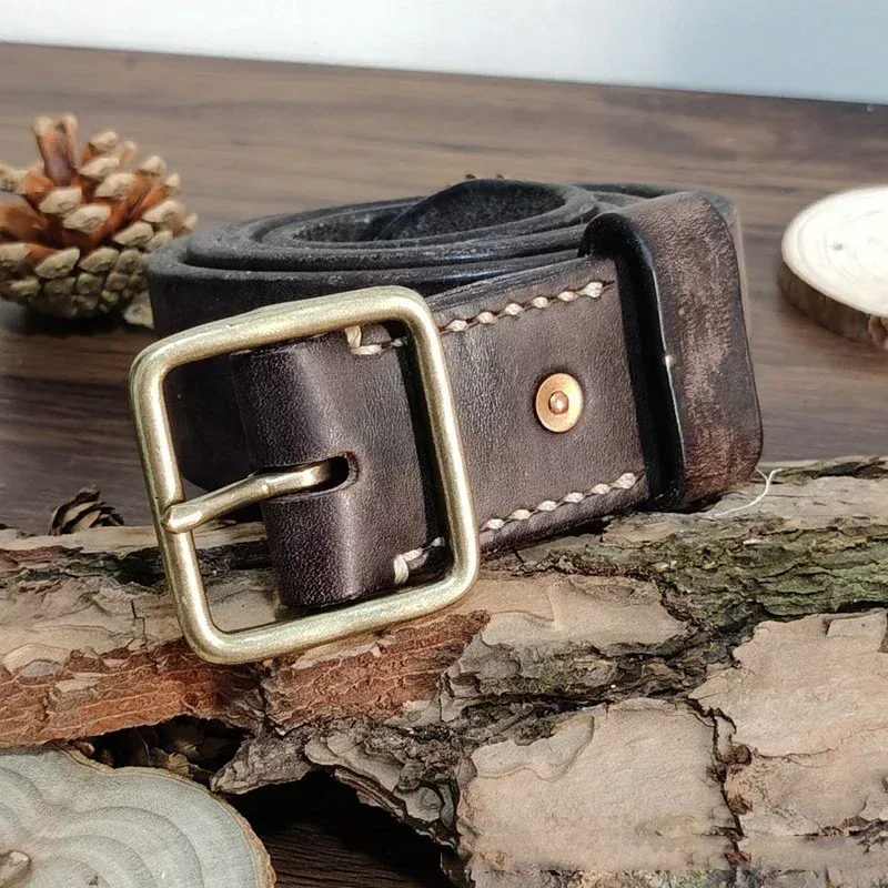Titan 41 Heavy-Duty Leather Belt with Brass Buckle Heavy-duty full-grain leather belt with solid brass buckle for durability.