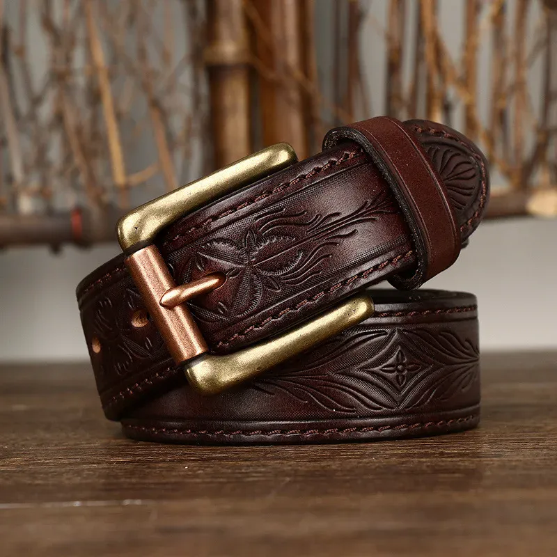 Leather belt with embossed design and solid brass buckle Embossed full-grain leather belt with brass buckle, stylish and durable accessory for men.