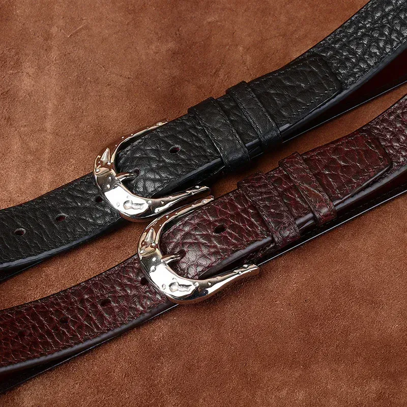 Black and Burgundy Leather Belts with Hammered Horseshoe Buckles Stylish leather belts with hammered horseshoe buckles in black and burgundy.
