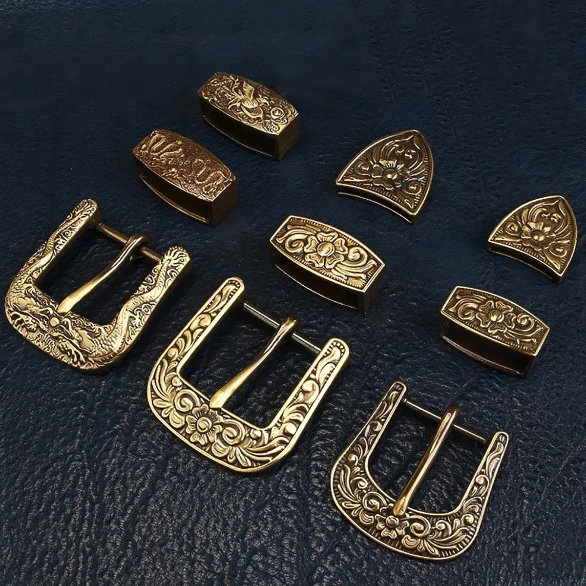 Artisan Brass Belt Buckle Set Antique-style brass belt buckles with intricate floral and scroll engravings.