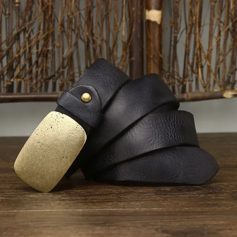 Vintage Brass & Cowhide Belt – The Iron Range Vintage brass and black cowhide belt with a sturdy buckle, perfect for stylish casual wear.