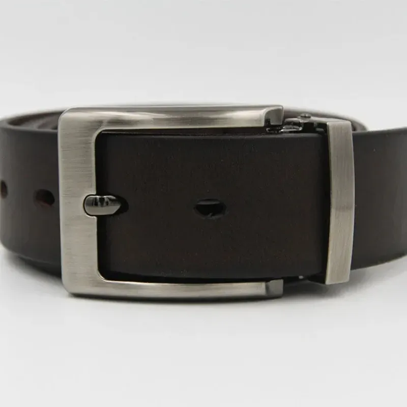 Leather belt with a stainless steel clip-on buckle for adjustable fit. Stainless steel clip-on buckle on a black leather belt for secure fastening.
