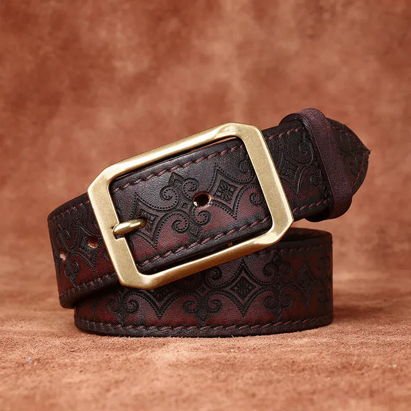 Heritage Floral Embossed Italian Cowhide Belt Heritage floral embossed Italian cowhide belt with brass buckle, handcrafted luxury accessory.