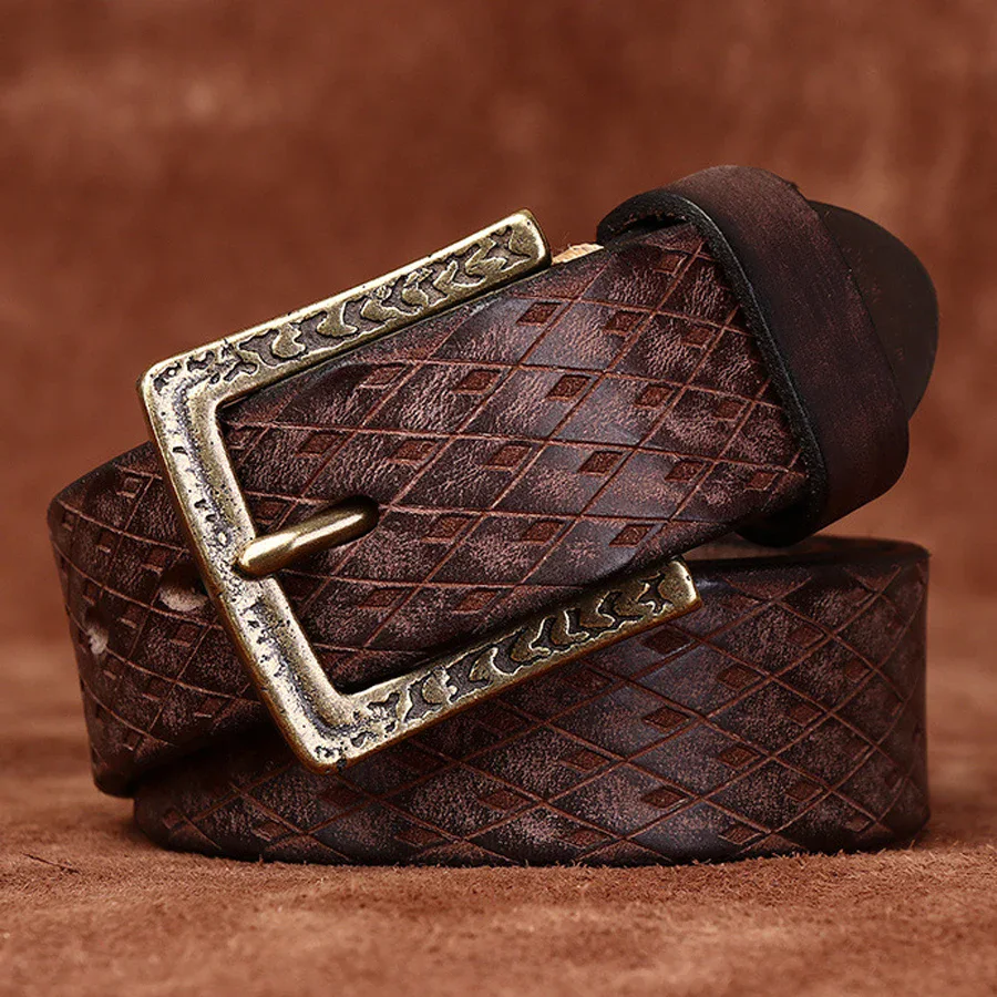 Hand-Carved Italian Cowhide Belt Elegant hand-carved Italian cowhide belt with antique brass buckle.