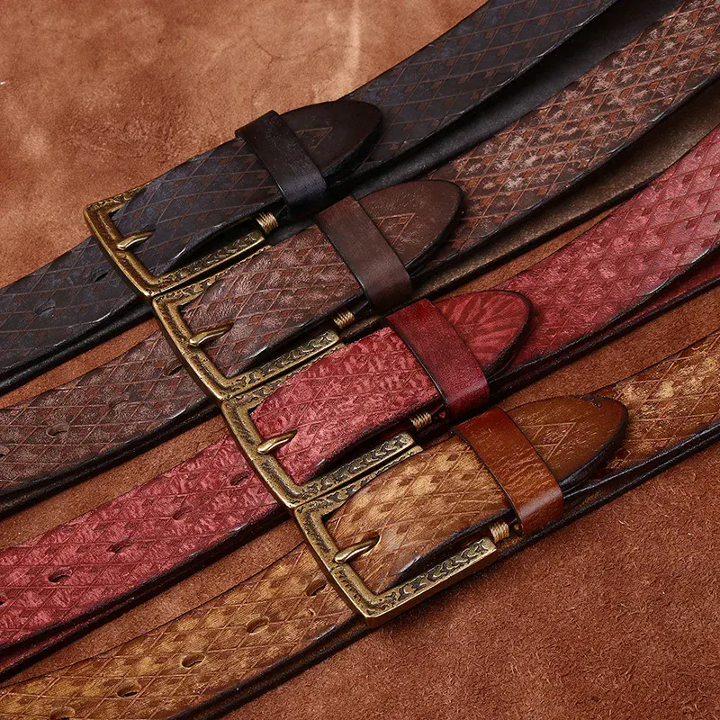 Elegant Italian cowhide belts with carved designs and brass buckles. Handcrafted leather belts featuring intricate carvings and rich colors.