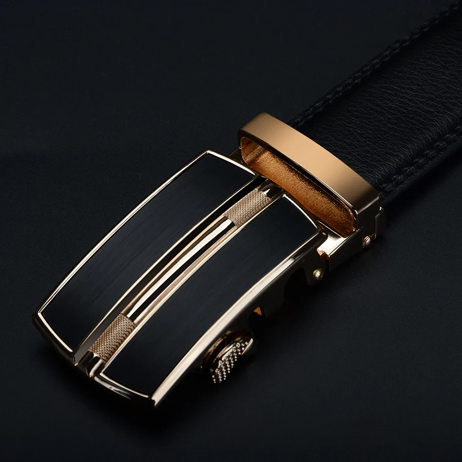 Gold-Accented Leather Ratchet Belt Elegant leather ratchet belt with gold accents for a sophisticated look. Perfect for formal and casu.