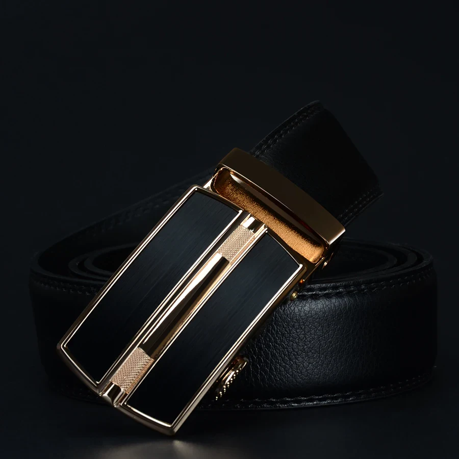 Leather ratchet belt with gold accents and sleek black design. Elegant leather ratchet belt featuring gold-tone hardware for a sophisticated look.