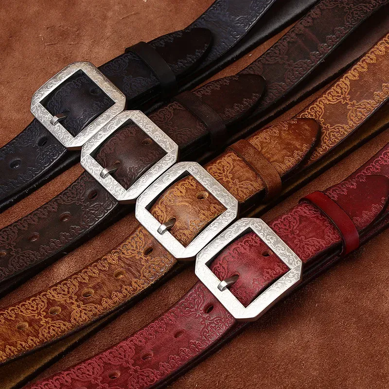 Elegant Leather Belts with Silver Buckles Leather belts with intricate embossed patterns and stainless steel buckles for men.
