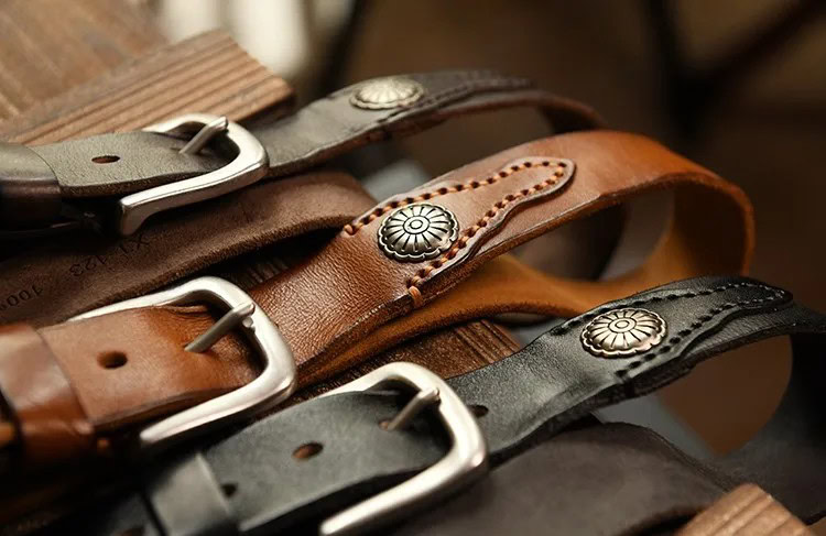 High-quality leather belts featuring metal conchos and durable buckles for stylish accessories.