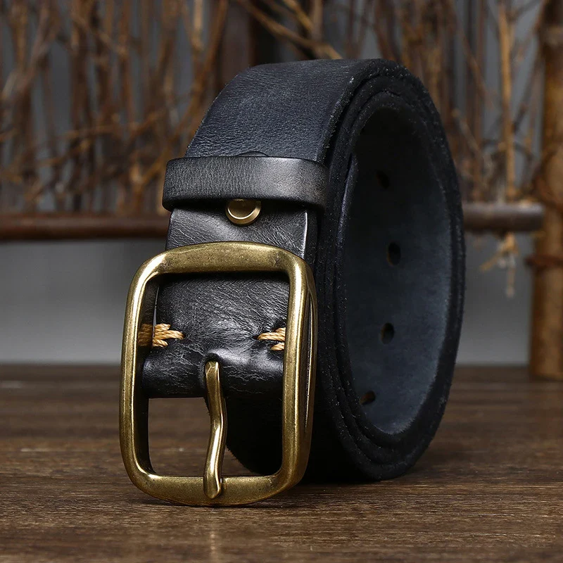 Leather casual men’s belt with brass buckle and black cowhide strap. Stylish men's leather belt featuring a vintage brass buckle and durable black cowhide leather.