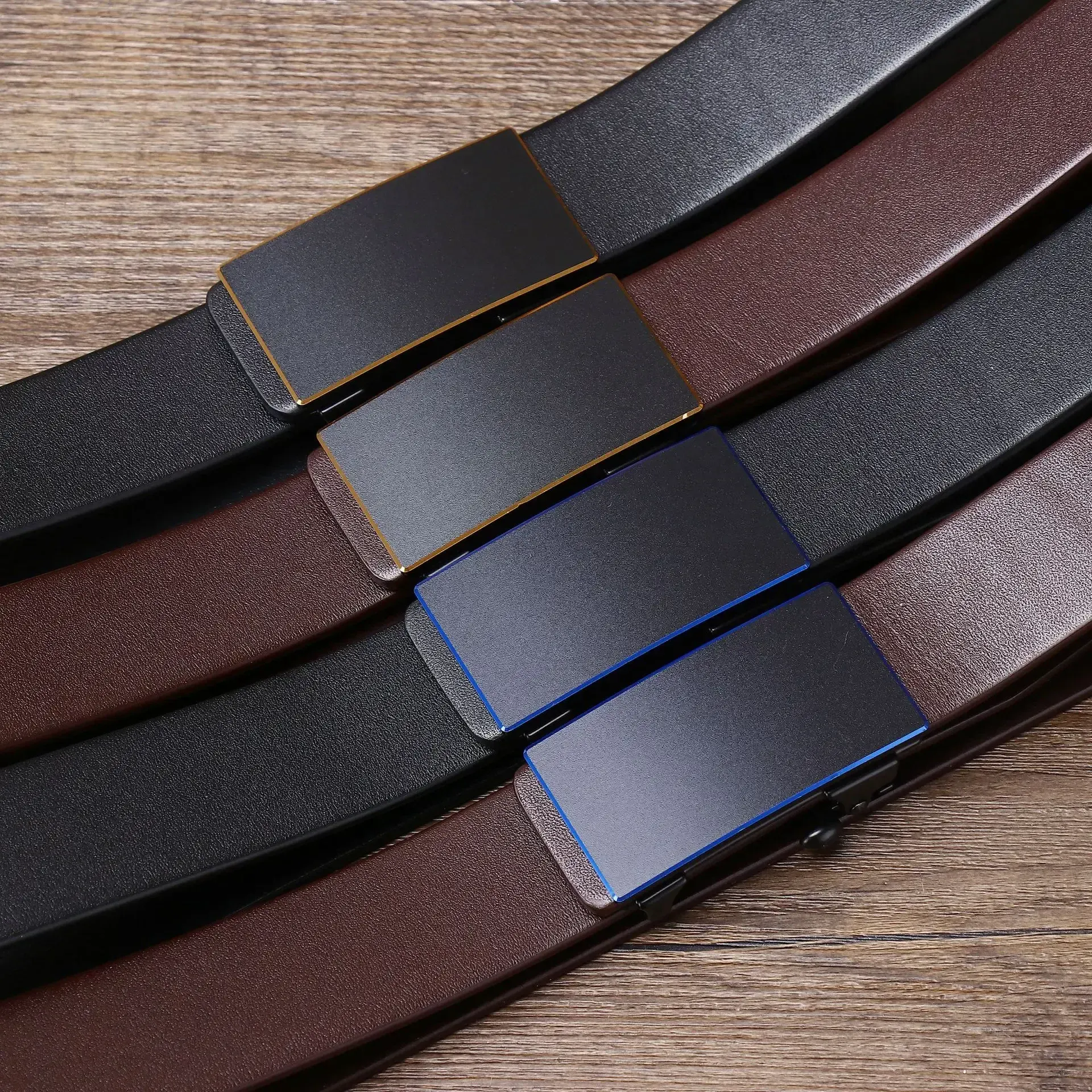 Black and brown ratchet belts with hidden tail design for men and women. High-quality leather belts with secure ratchet buckle for easy adjustment.