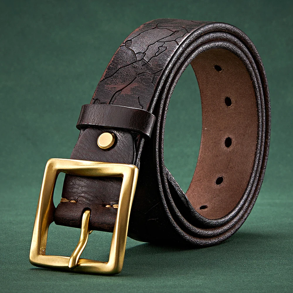 Leather cracked belt with gold buckle, men’s fashion accessory, vintage style. Vintage men's leather belt with cracked finish and gold buckle for stylish outfits.