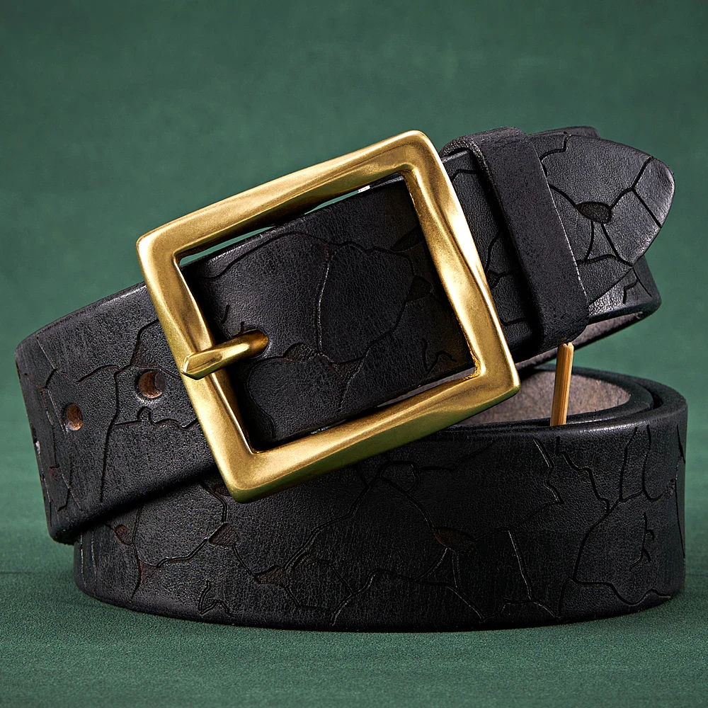 Leather belt with cracked design and gold buckle, stylish men’s fashion accessory. Stylish men's leather belt featuring a cracked pattern and a bold gold buckle for trendy fashion.