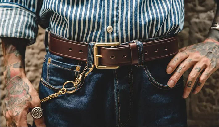 High-quality brown leather belt featuring a gold buckle, perfect for versatile men's fashion.