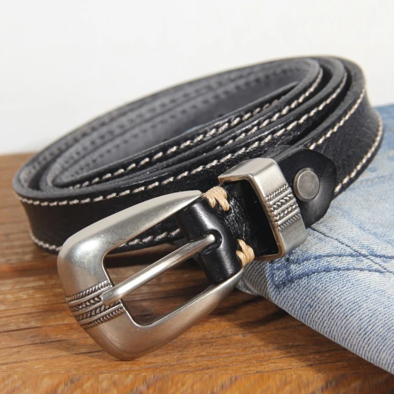 Leather women’s belt with silver buckle, versatile and stylish accessory for jeans and casual outfits. Stylish women's leather belt with silver buckle, perfect for jeans and casual wear.