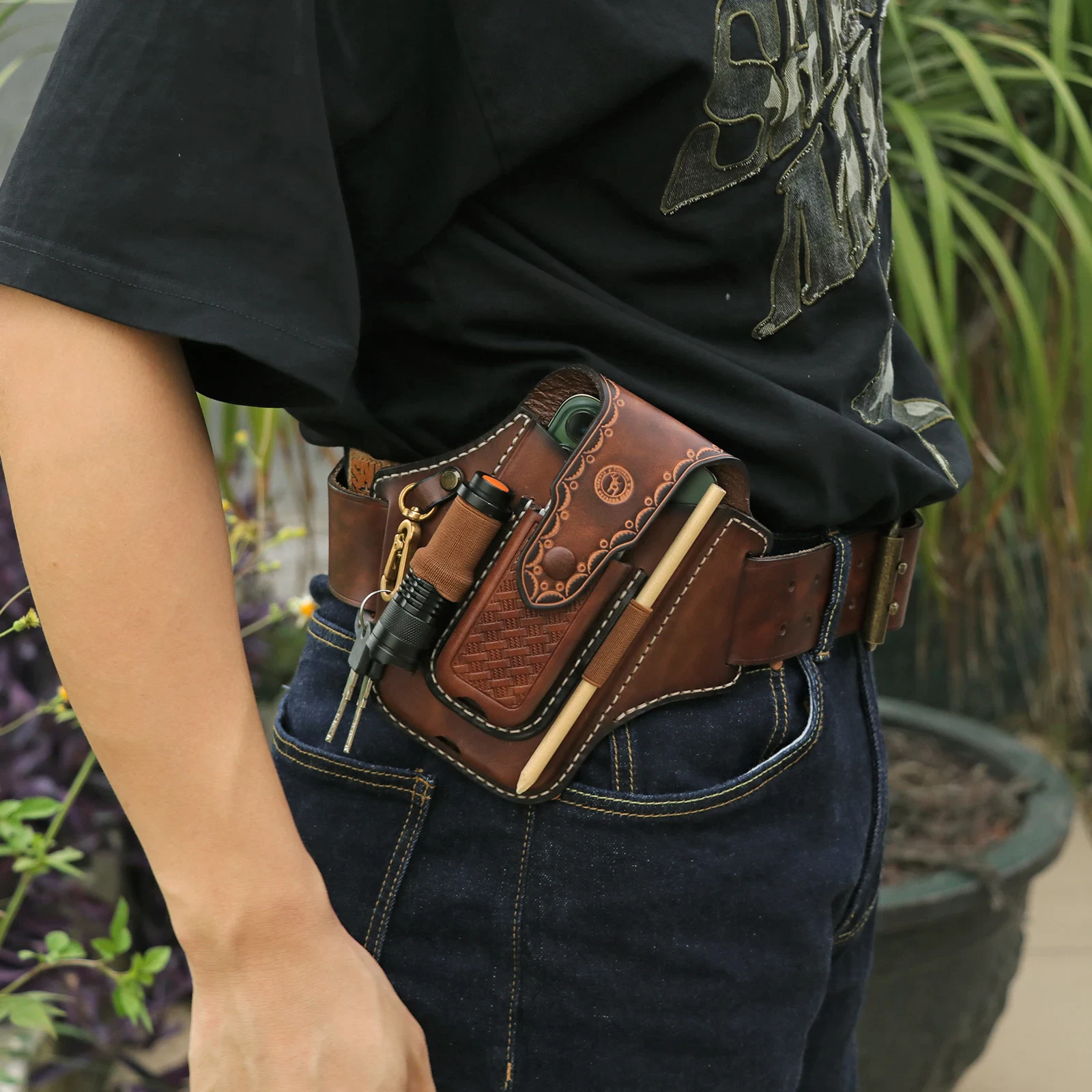 Compact Leather EDC Knife Sheath with Pocket Organizer Leather EDC knife sheath with multiple pockets for flashlight, phone, and keys.