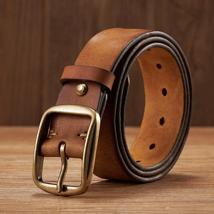 Full-grain leather belt with brass buckle and ratchet closure.
