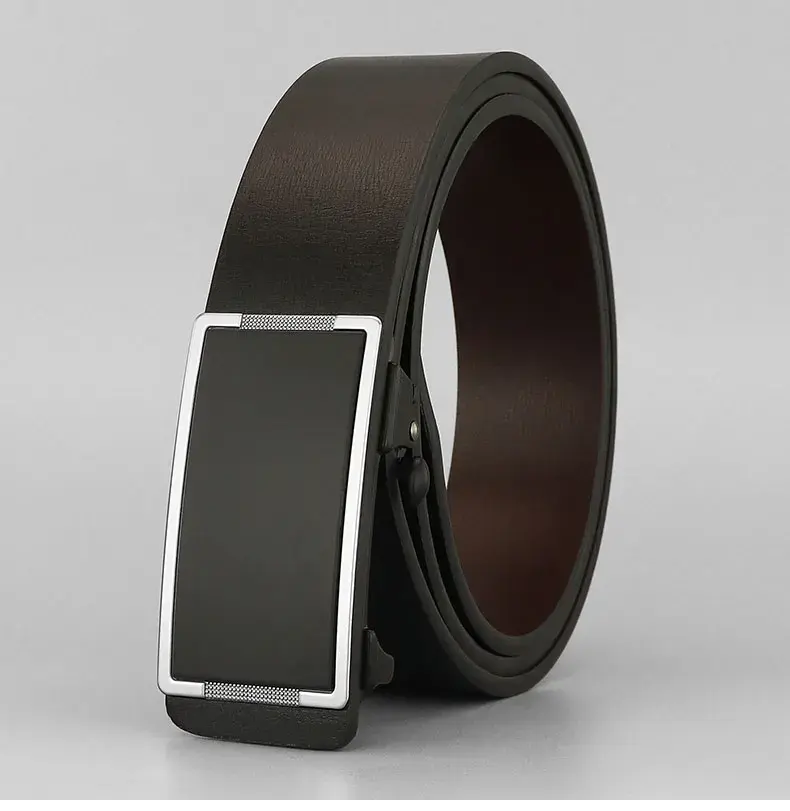 Engineered leather belt for men with hidden-tail ratchet buckle, dark brown color, slim profile.